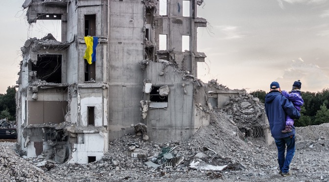 Destruction in Ukraine, man and child